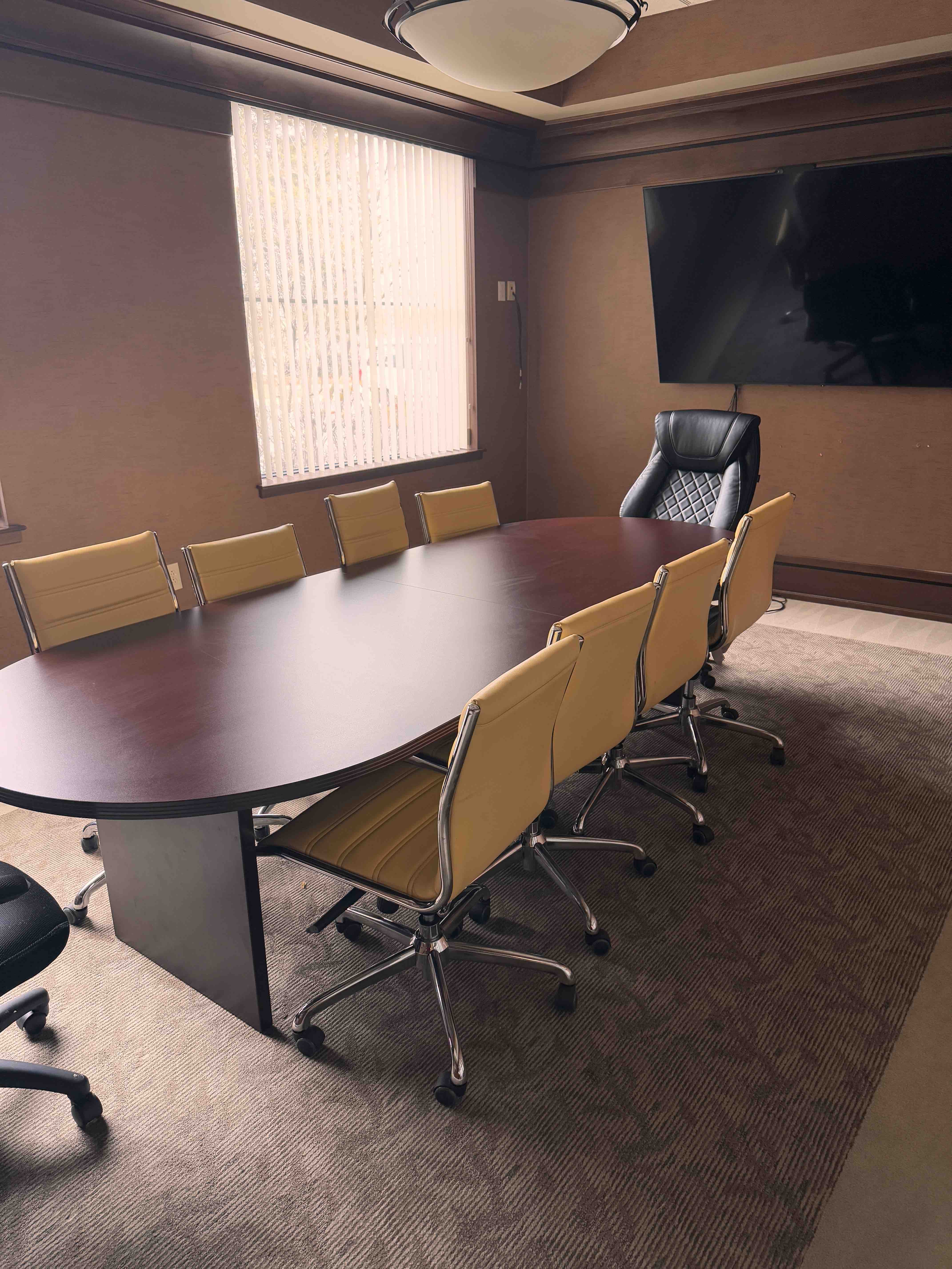 Conference room with table and presentation screen